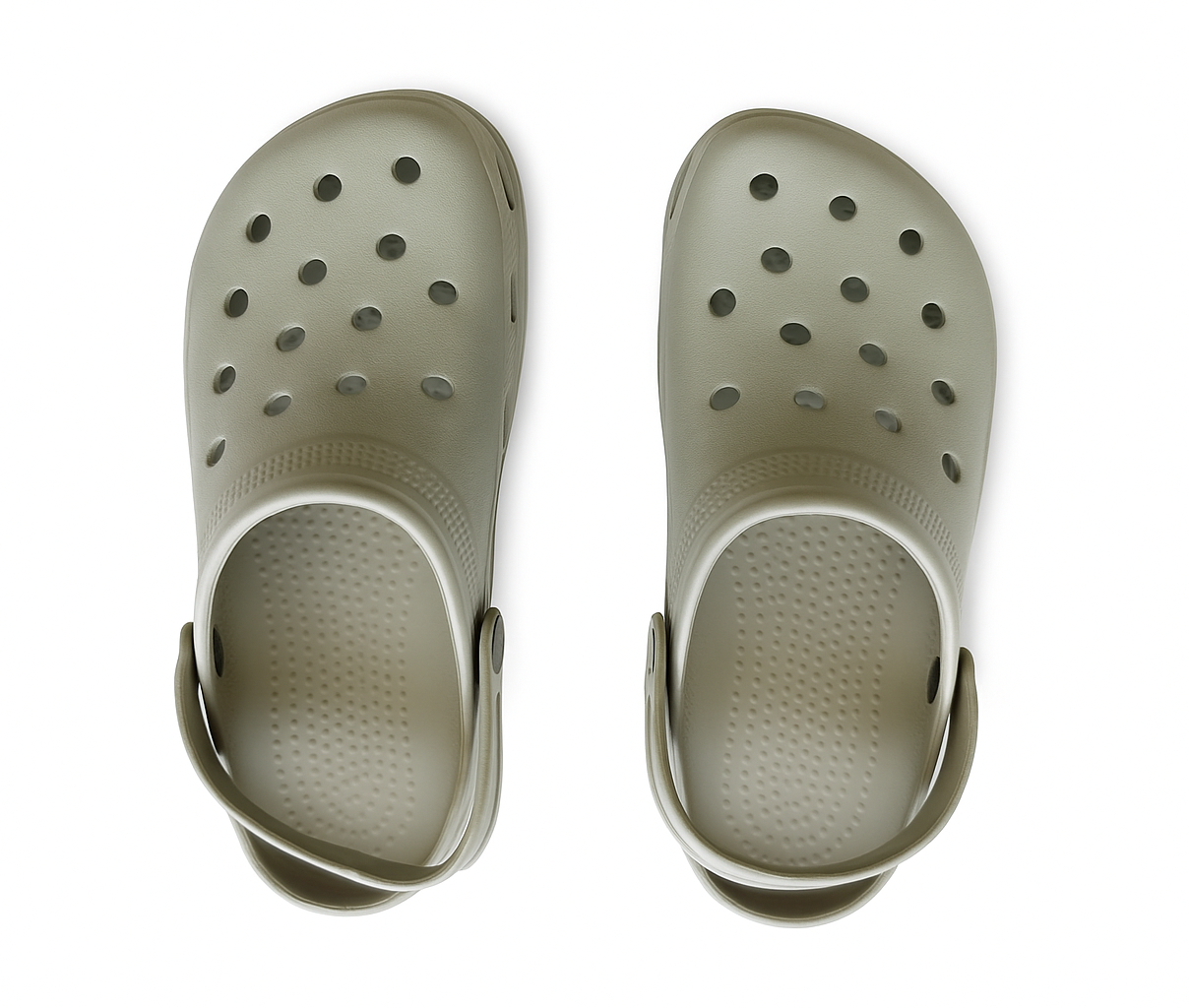 Pair of beige clogs on a white background