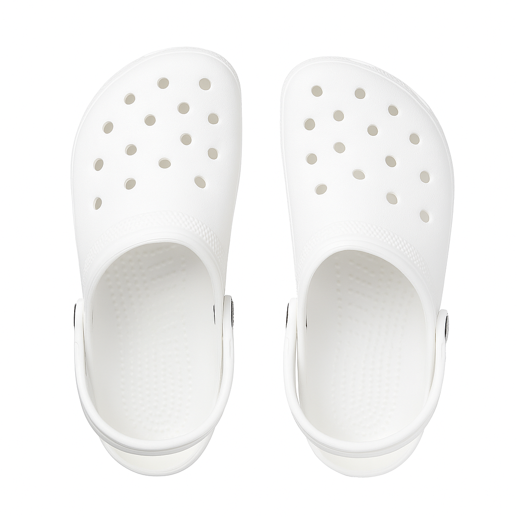 Pair of white clogs with holes on a white background