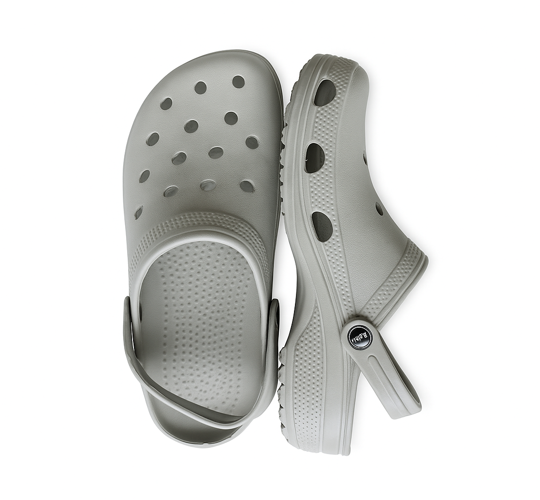 Pair of light gray clogs on a white background