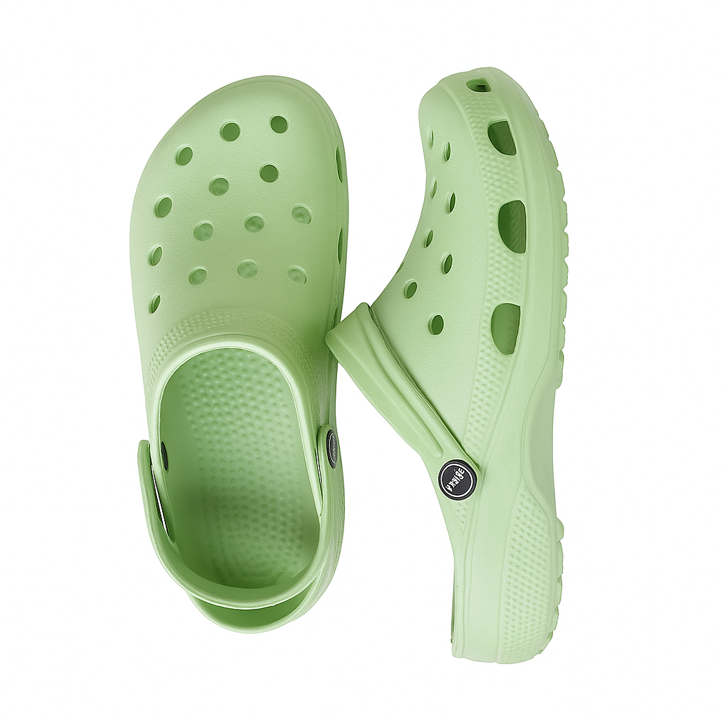 Pair of light green clogs on a white background