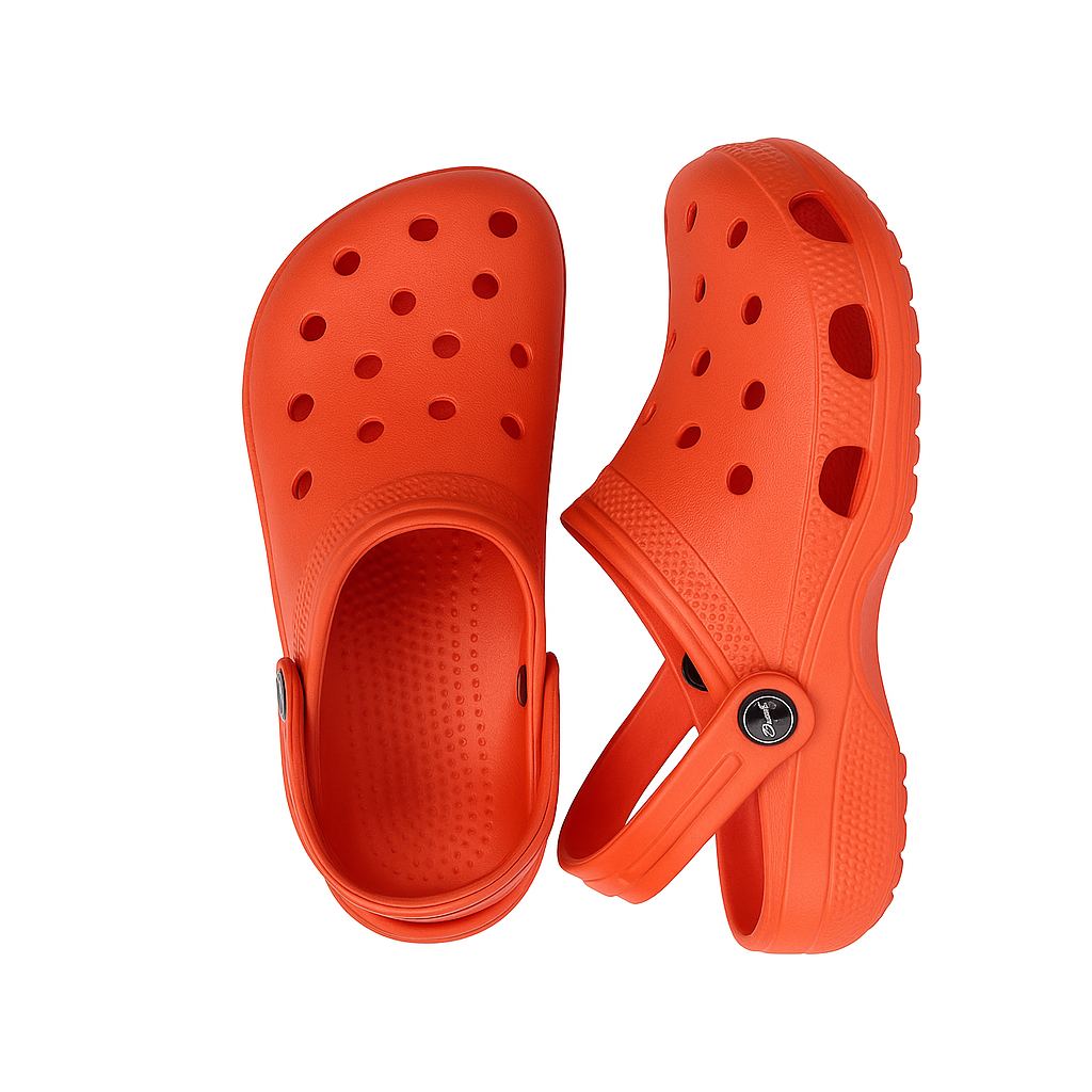 Pair of orange clogs on a white background