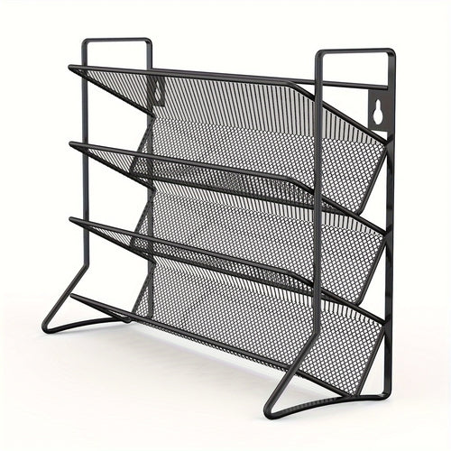 Black metal mesh magazine rack on a white background